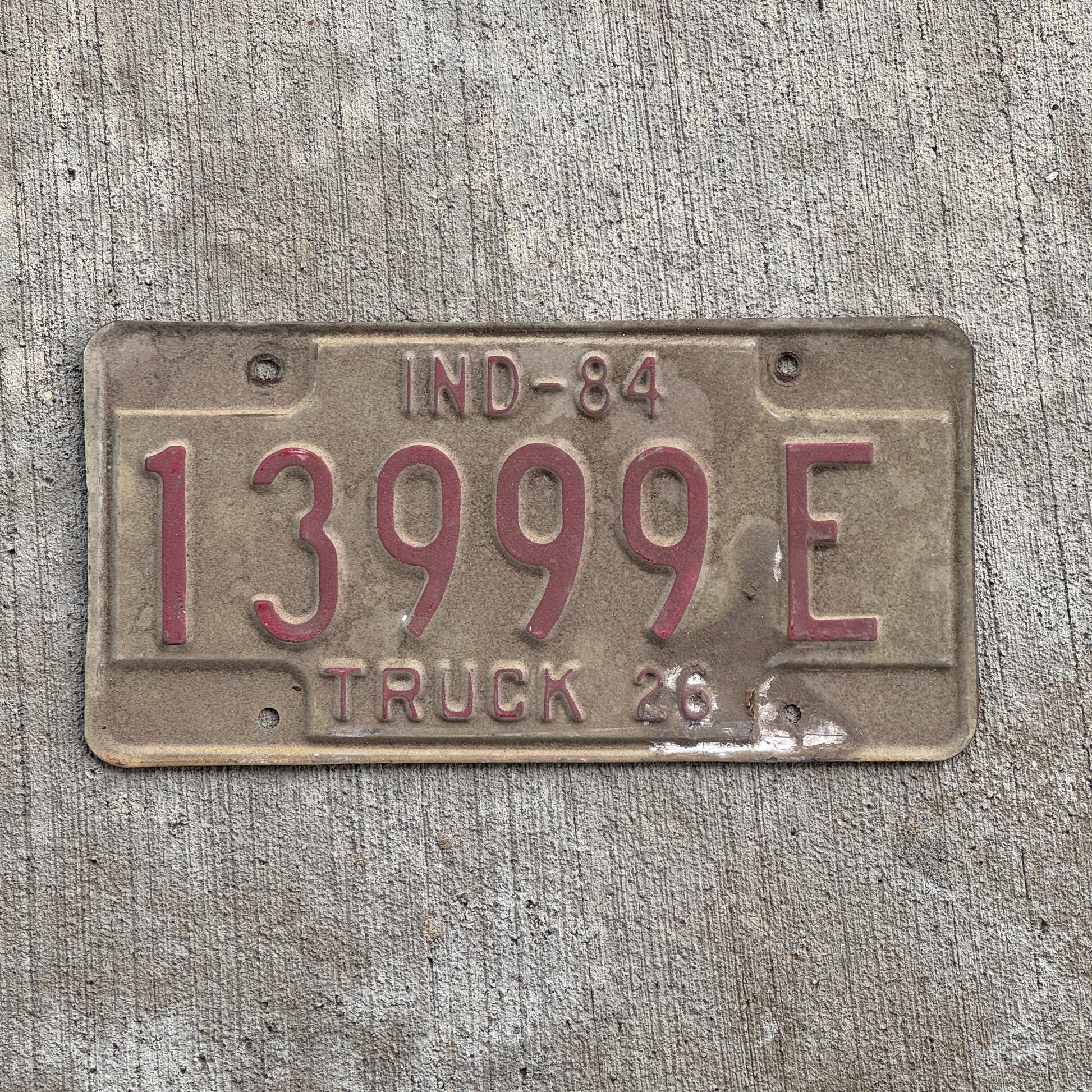 Photo of a 1984 Indiana Truck License Plate Auto Tag Garage Decor Vintage Repeat Repeating 13999 E with original patina