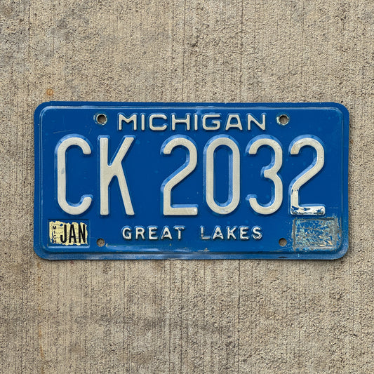 Photo of a 1984 Michigan Commercial License Plate Auto Tag Garage Decor Vintage CK 2032 with original patina