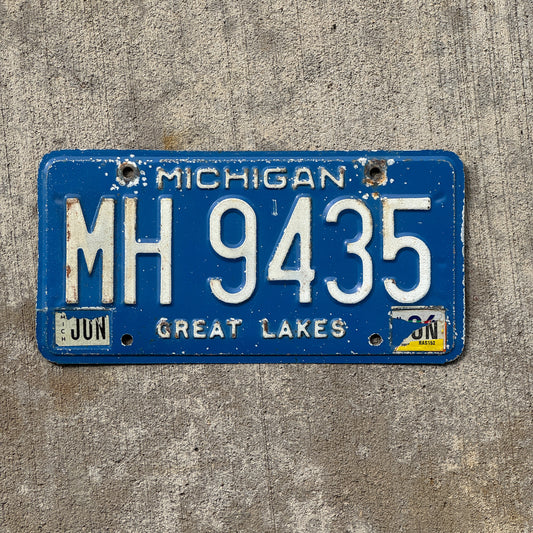 Photo of a 1984 Michigan Commercial License Plate Auto Tag Garage Decor Vintage MH 9435 with original patina