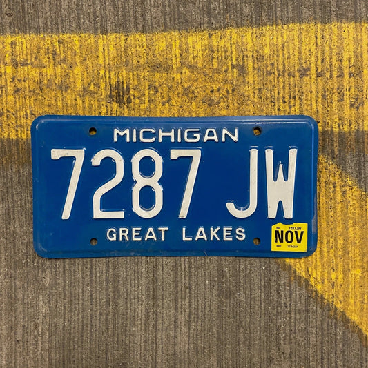 Photo of a 1984 Michigan License Plate Auto Tag Garage Decor Vintage Great Lakes 7287 JW