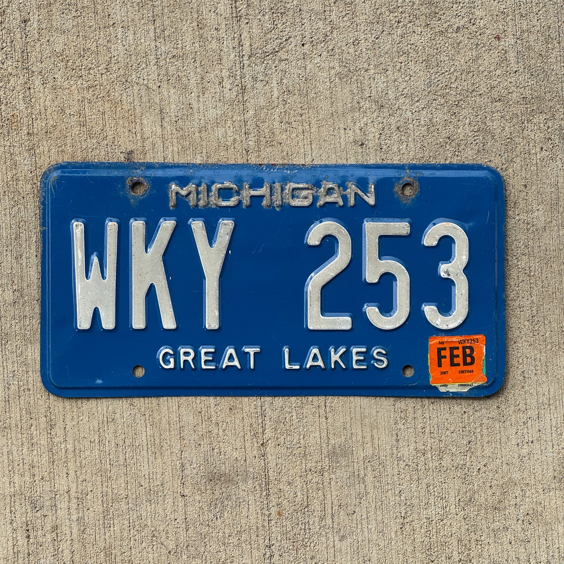 Photo of a 1984 Michigan License Plate Auto Tag Garage Decor Vintage WKY 253 with original patina