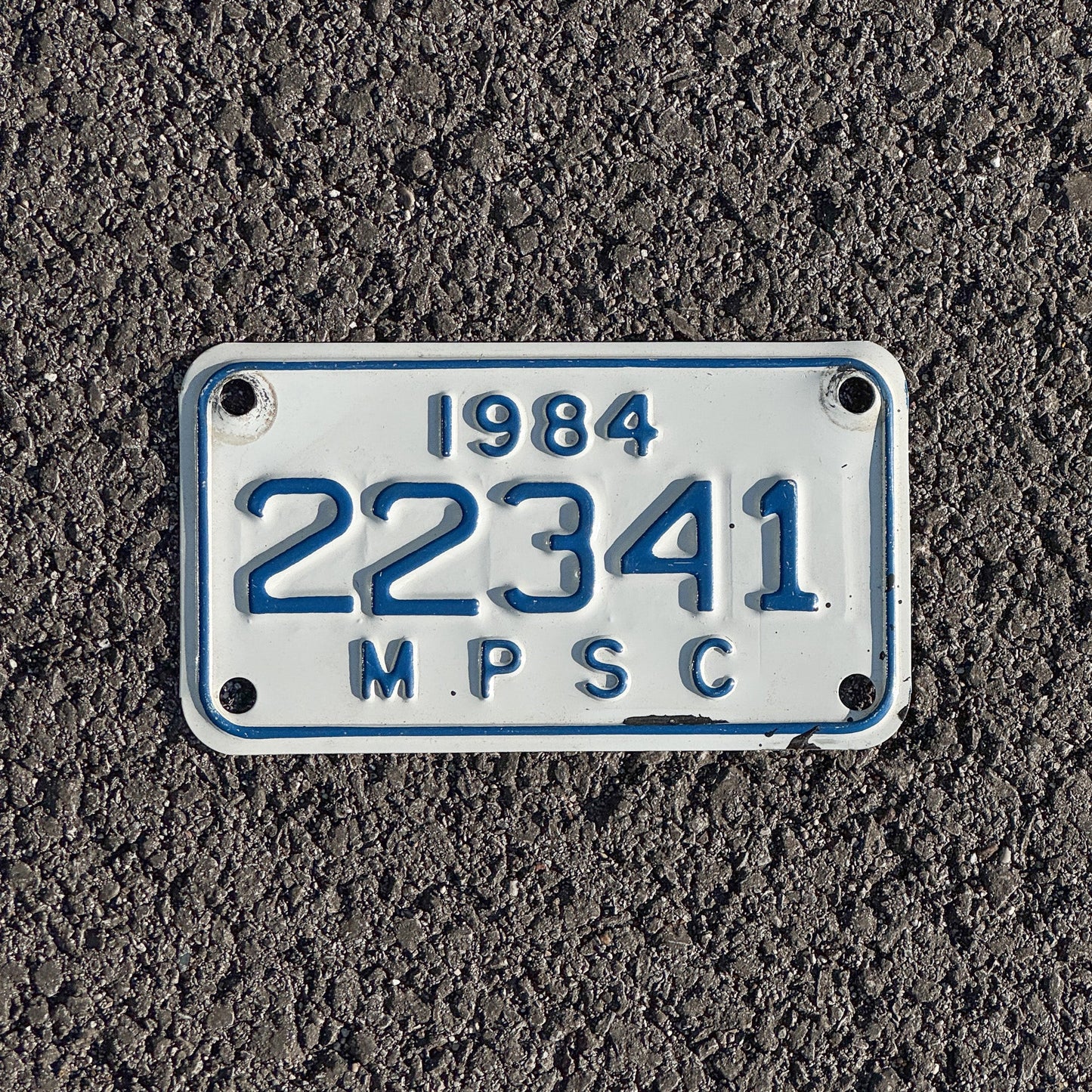 Photo of a 1984 Michigan MPSC License Plate Auto Tag Garage Decor Vintage Public Services Commission 22341