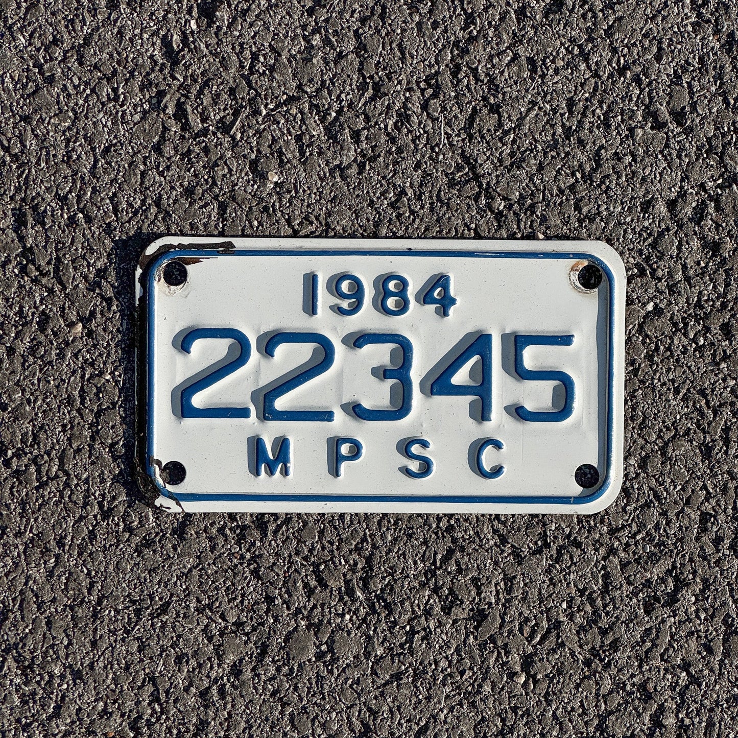 Photo of a 1984 Michigan MPSC License Plate Auto Tag Garage Decor Vintage Public Services Commission 22345