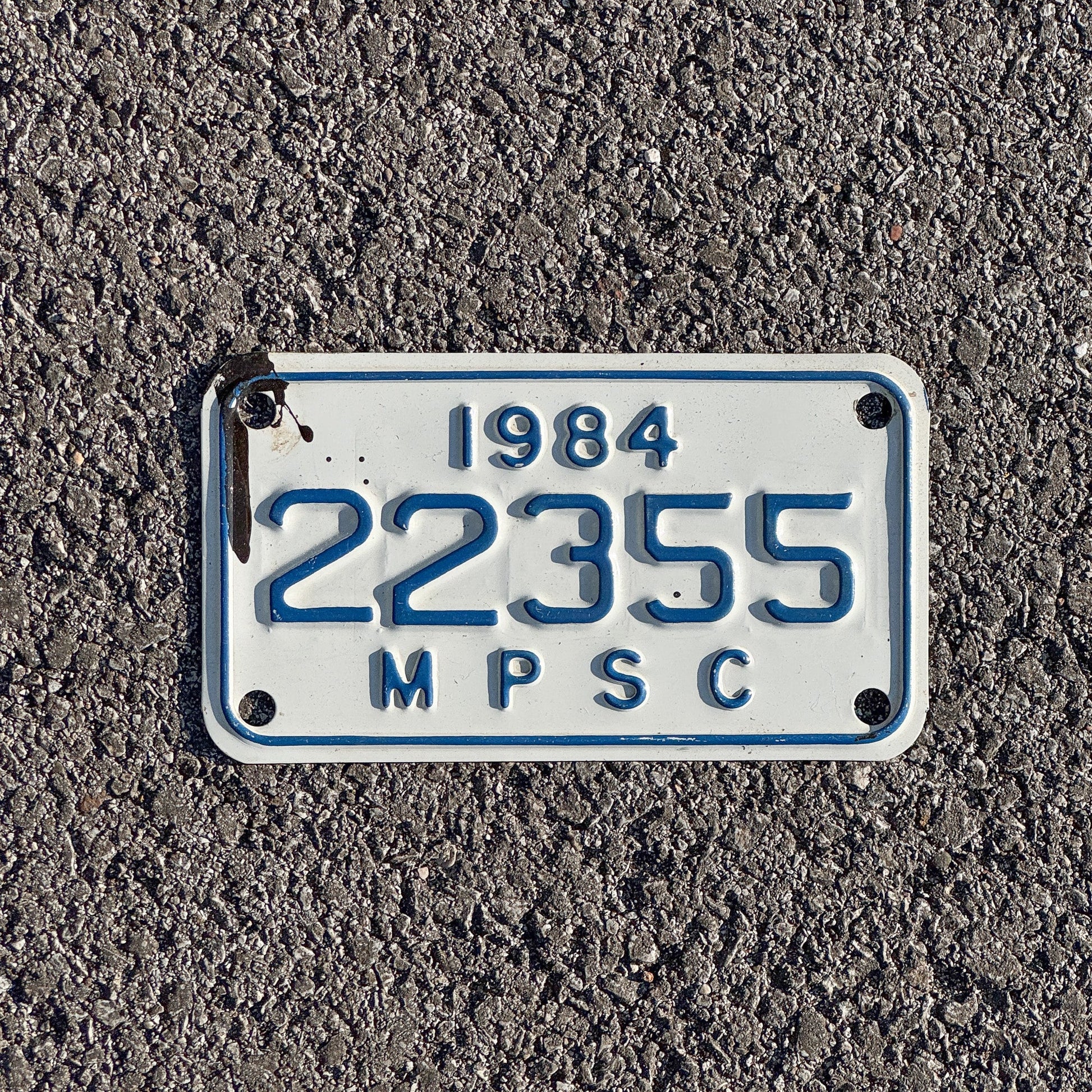 Photo of a 1984 Michigan MPSC License Plate Auto Tag Garage Decor Vintage Public Services Commission 22355