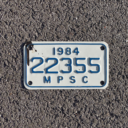 Photo of a 1984 Michigan MPSC License Plate Auto Tag Garage Decor Vintage Public Services Commission 22355