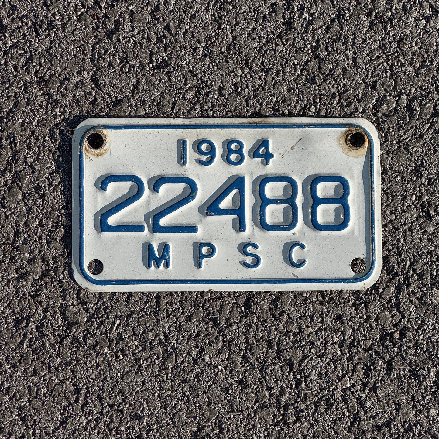 Photo of a 1984 Michigan MPSC License Plate Auto Tag Garage Decor Vintage Public Services Commission 22488