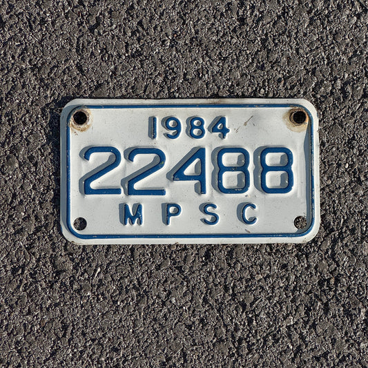 Photo of a 1984 Michigan MPSC License Plate Auto Tag Garage Decor Vintage Public Services Commission 22488