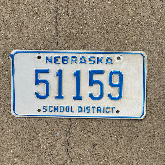 Photo of a 1984 Nebraska School District License Plate Auto Tag Garage Decor Vintage 51159