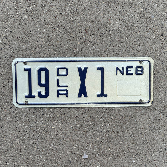 Photo of a 1984 Nebraska Trailer Dealer License Plate Auto Tag Garage Decor Vintage 19 X 1 with original patina