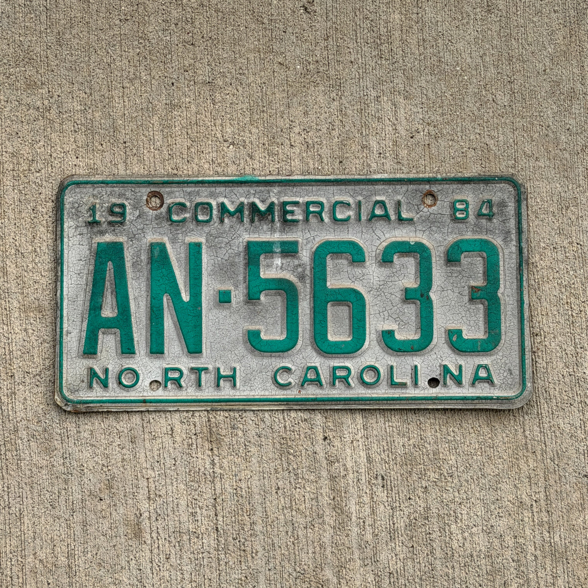 Photo of a 1984 North Carolina Commercial License Plate Auto Tag Garage Decor Vintage AN 5633 with original patina