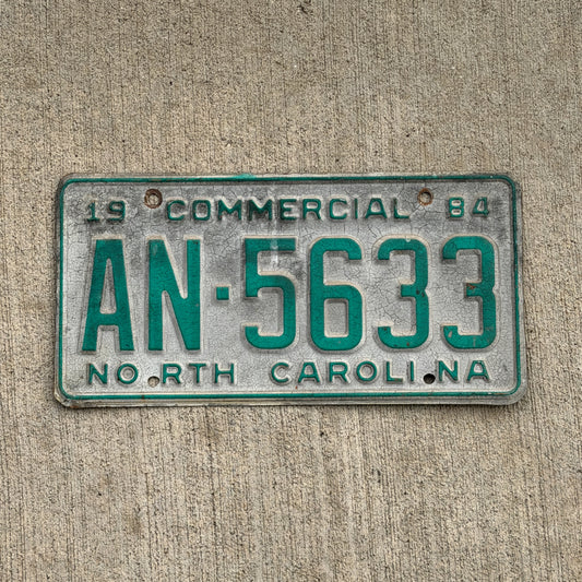 Photo of a 1984 North Carolina Commercial License Plate Auto Tag Garage Decor Vintage AN 5633 with original patina