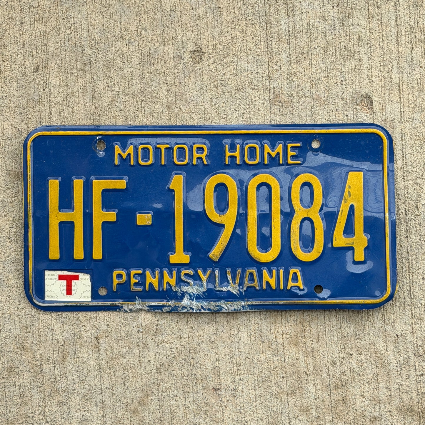 Photo of a 1984 Pennsylvania Motor Home License Plate Auto Tag Garage Decor Vintage HF 19084 with original patina