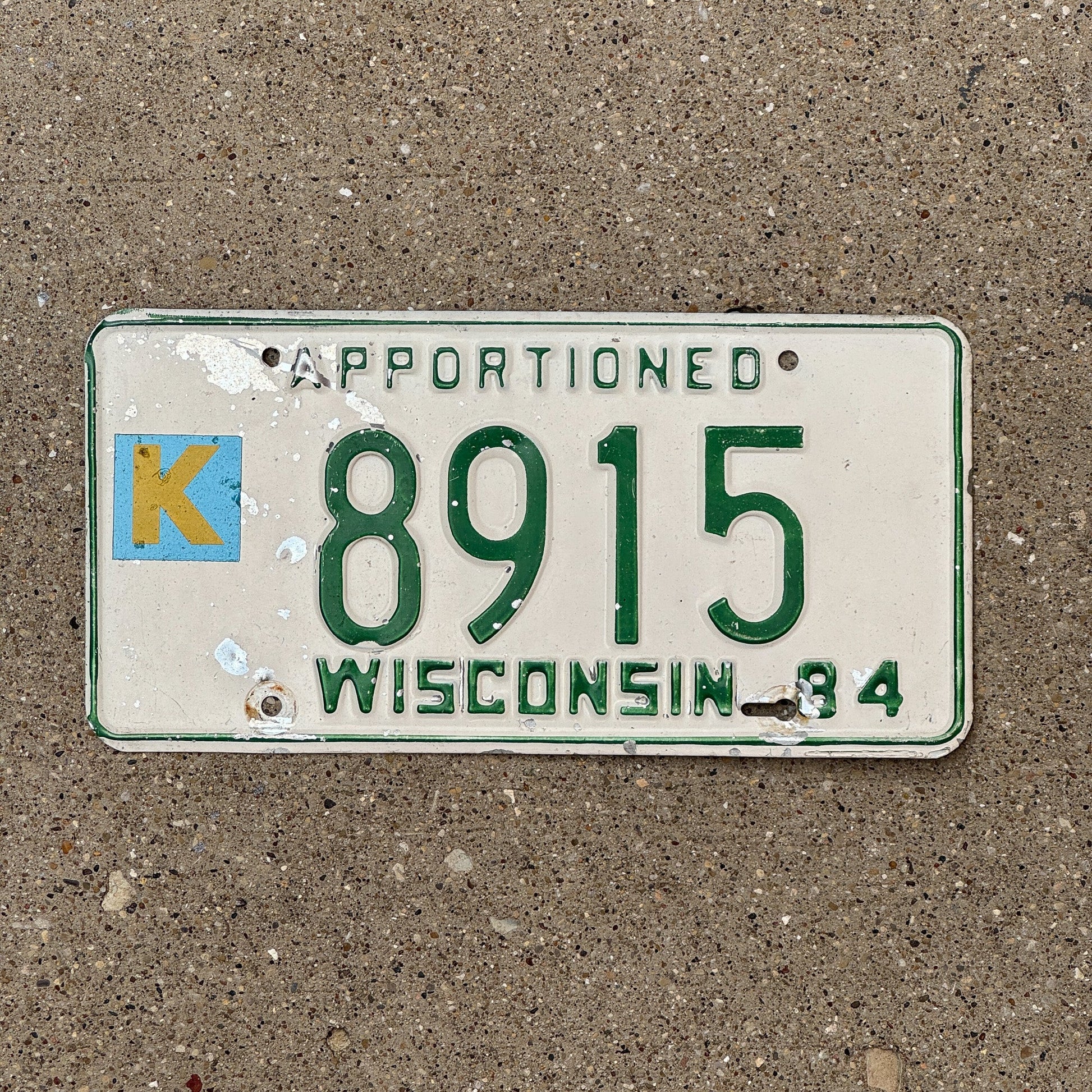 Photo of a 1984 Wisconsin Apportioned License Plate Auto Tag Garage Decor Vintage 8915