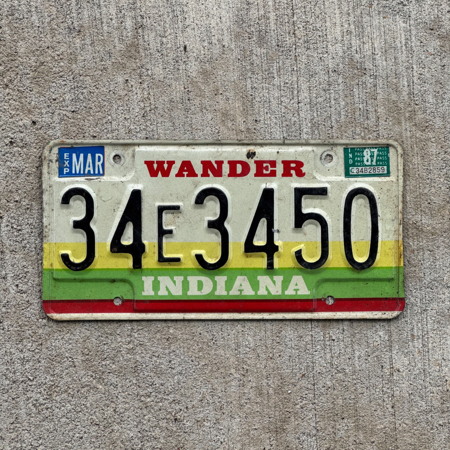 Photo of a 1985 1987 Indiana License Plate Auto Tag Garage Decor Vintage 34 E 3450 with original patina