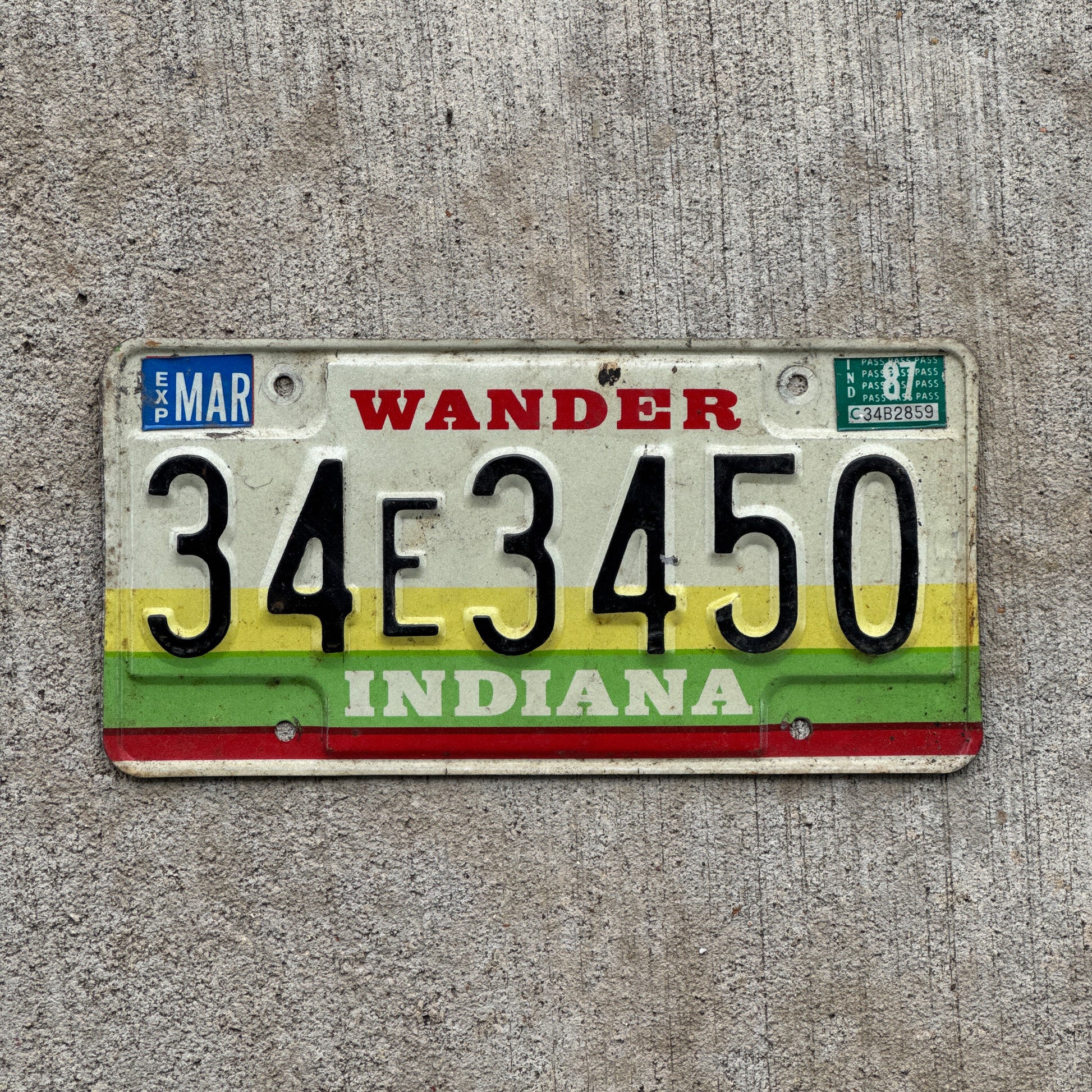 Photo of a 1985 1987 Indiana License Plate Auto Tag Garage Decor Vintage 34 E 3450 with original patina