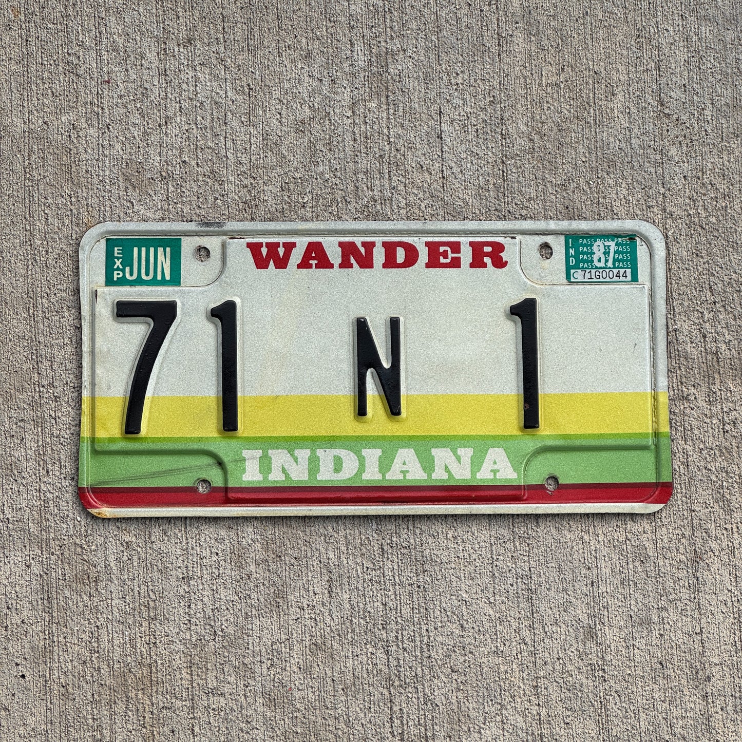 Photo of a 1985 1987 Indiana License Plate Auto Tag Garage Decor Vintage St. Joseph County Low Number 71 N 1 with original patina