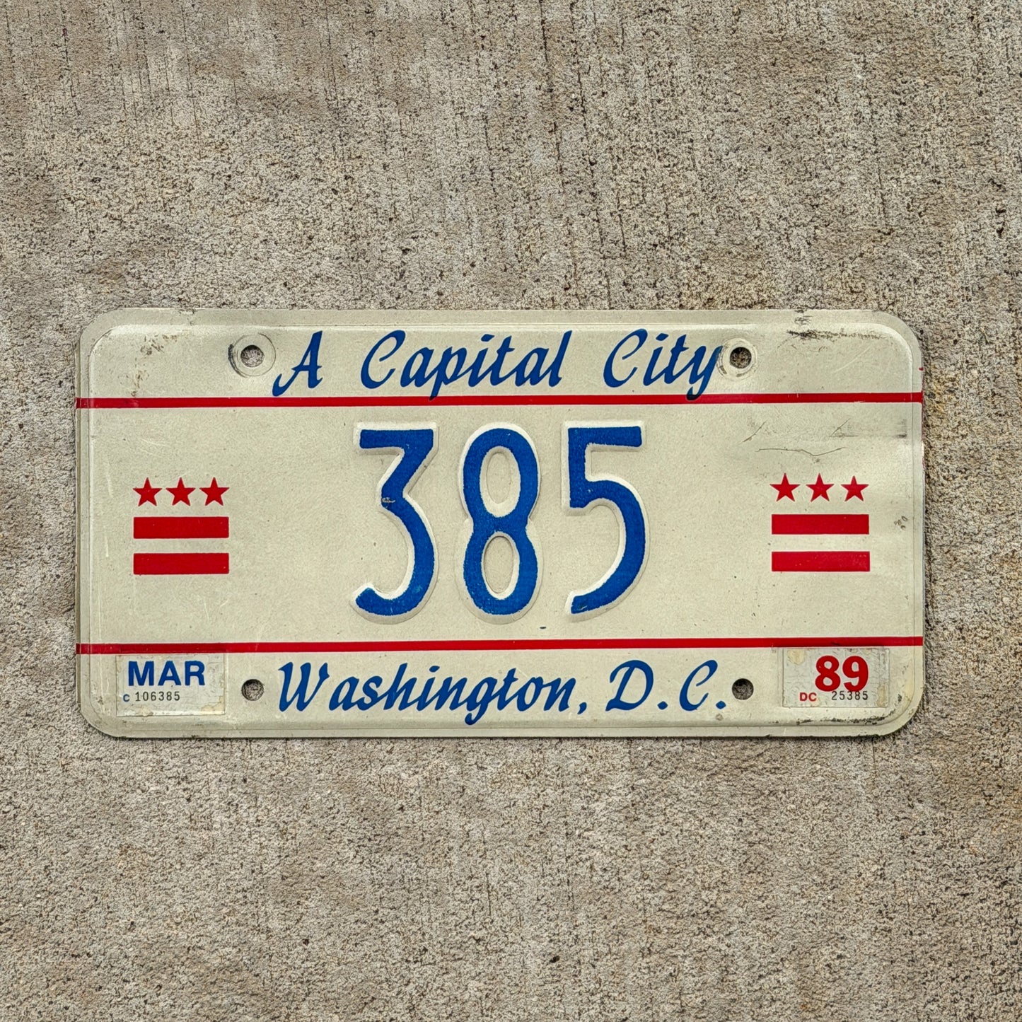 Photo of a 1985 1989 Washington DC License Plate Auto Tag Garage Decor Vintage Reserved Low Number Three Digit 385 with original patina