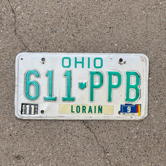 Photo of a 1985 1991 Ohio License Plate Auto Tag 1 Vintage Garage 611 PPB with original patina