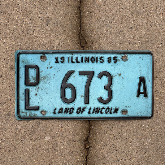 Photo of a 1985 Illinois Dealer License Plate Auto Tag 1 Vintage Garage Merritt's Sterling Ford Mercury Lincoln Dealer 673 A with original patina