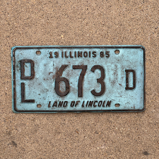 Photo of a 1985 Illinois Dealer License Plate Auto Tag 1 Vintage Garage Merritt's Sterling Ford Mercury Lincoln Dealer 673 D with original patina