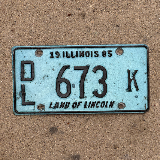 Photo of a 1985 Illinois Dealer License Plate Auto Tag 1 Vintage Garage Merritt's Sterling Ford Mercury Lincoln Dealer 673 K with original patina
