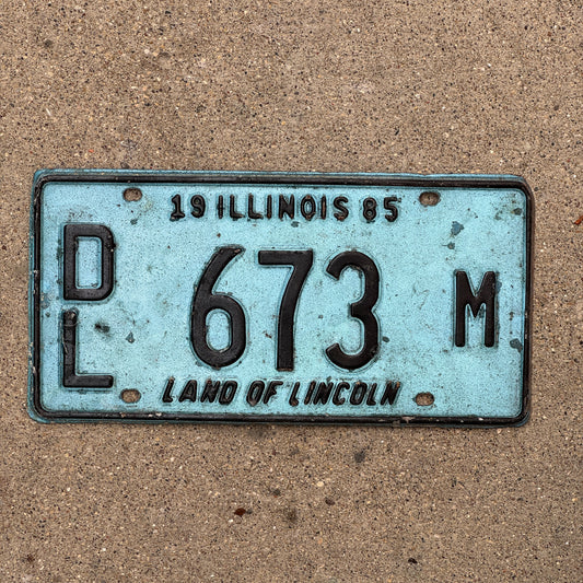 Photo of a 1985 Illinois Dealer License Plate Auto Tag 1 Vintage Garage Merritt's Sterling Ford Mercury Lincoln Dealer 673 M with original patina