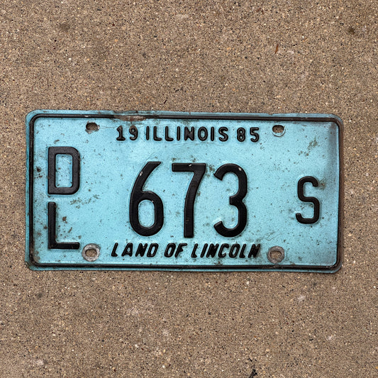 Photo of a 1985 Illinois Dealer License Plate Auto Tag 1 Vintage Garage Merritt's Sterling Ford Mercury Lincoln Dealer 673 S with original patina