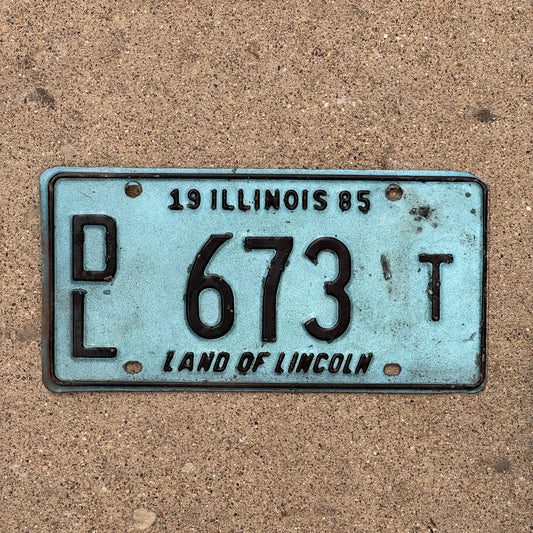Photo of a 1985 Illinois Dealer License Plate Auto Tag 1 Vintage Garage Merritt's Sterling Ford Mercury Lincoln Dealer 673 T with original patina
