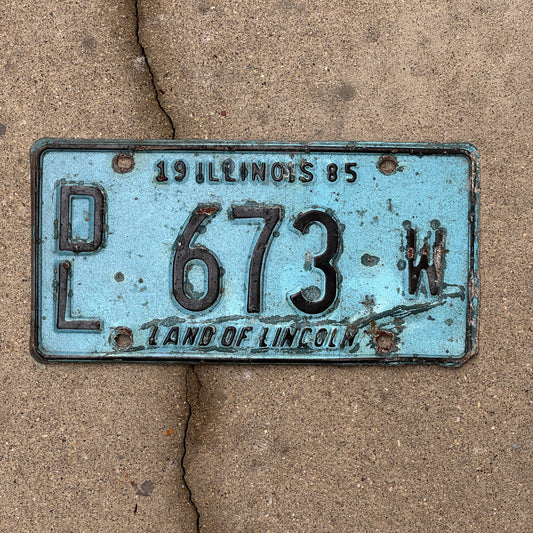Photo of a 1985 Illinois Dealer License Plate Auto Tag 1 Vintage Garage Merritt's Sterling Ford Mercury Lincoln Dealer 673 W with original patina