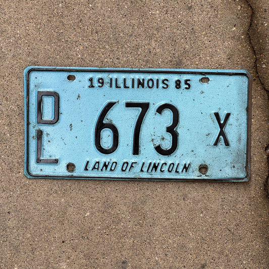 Photo of a 1985 Illinois Dealer License Plate Auto Tag 1 Vintage Garage Merritt's Sterling Ford Mercury Lincoln Dealer 673 X with original patina
