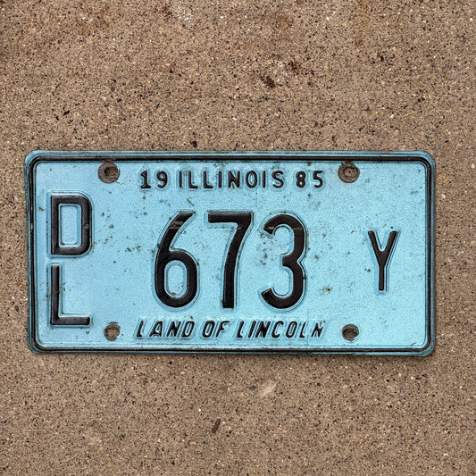 Photo of a 1985 Illinois Dealer License Plate Auto Tag 1 Vintage Garage Merritt's Sterling Ford Mercury Lincoln Dealer 673 Y with original patina