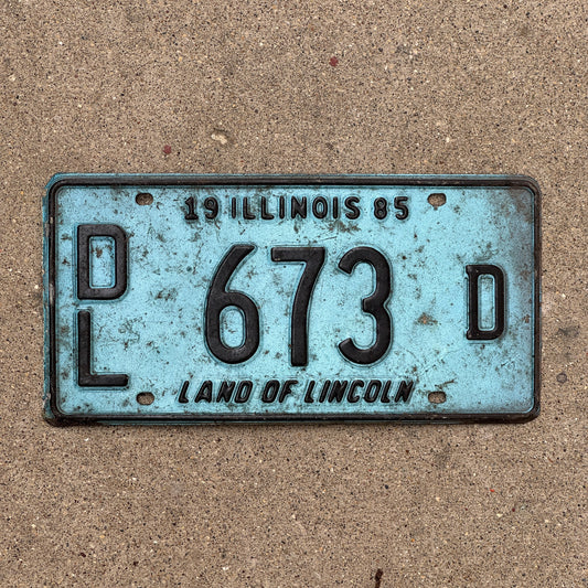 Photo of a 1985 Illinois Dealer License Plate Auto Tag 2 Vintage Garage Merritt's Sterling Ford Mercury Lincoln Dealer 673 D with original patina
