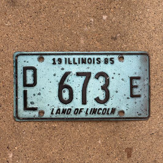 Photo of a 1985 Illinois Dealer License Plate Auto Tag 2 Vintage Garage Merritt's Sterling Ford Mercury Lincoln Dealer 673 E with original patina