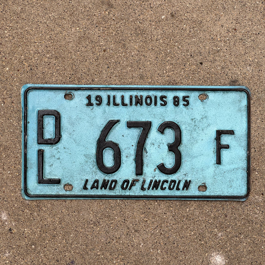 Photo of a 1985 Illinois Dealer License Plate Auto Tag 2 Vintage Garage Merritt's Sterling Ford Mercury Lincoln Dealer 673 F with original patina