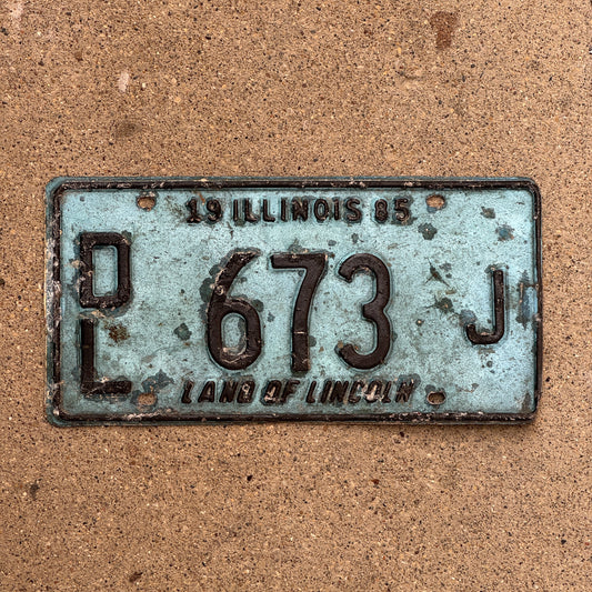 Photo of a 1985 Illinois Dealer License Plate Auto Tag 2 Vintage Garage Merritt's Sterling Ford Mercury Lincoln Dealer 673 J with original patina