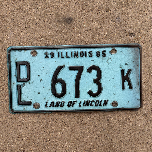 Photo of a 1985 Illinois Dealer License Plate Auto Tag 2 Vintage Garage Merritt's Sterling Ford Mercury Lincoln Dealer 673 K with original patina