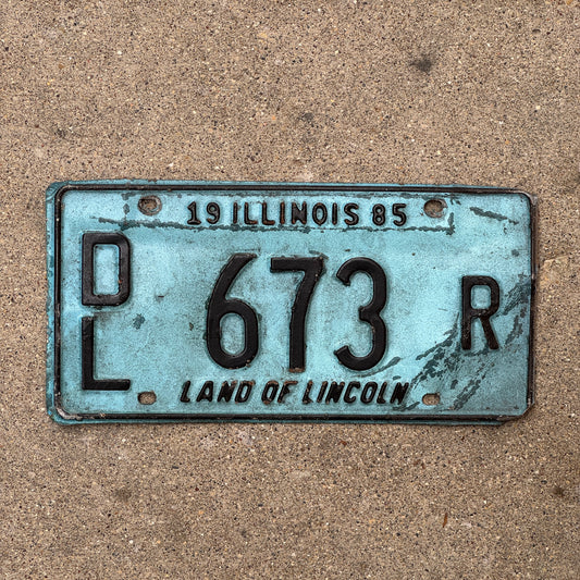 Photo of a 1985 Illinois Dealer License Plate Auto Tag 2 Vintage Garage Merritt's Sterling Ford Mercury Lincoln Dealer 673 R with original patina