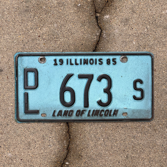 Photo of a 1985 Illinois Dealer License Plate Auto Tag 2 Vintage Garage Merritt's Sterling Ford Mercury Lincoln Dealer 673 S with original patina