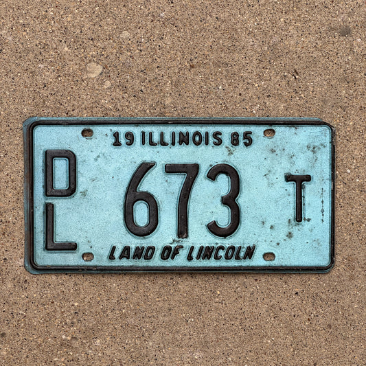 Photo of a 1985 Illinois Dealer License Plate Auto Tag 2 Vintage Garage Merritt's Sterling Ford Mercury Lincoln Dealer 673 T with original patina