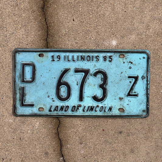Photo of a 1985 Illinois Dealer License Plate Auto Tag 2 Vintage Garage Merritt's Sterling Ford Mercury Lincoln Dealer 673 Z with original patina