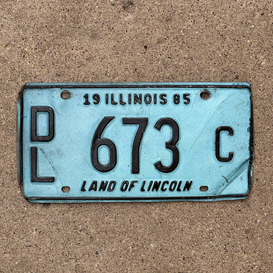 Photo of a 1985 Illinois Dealer License Plate Auto Tag Garage Decor Vintage Merritt's Sterling Ford Mercury Lincoln Dealer 673 C with original patina