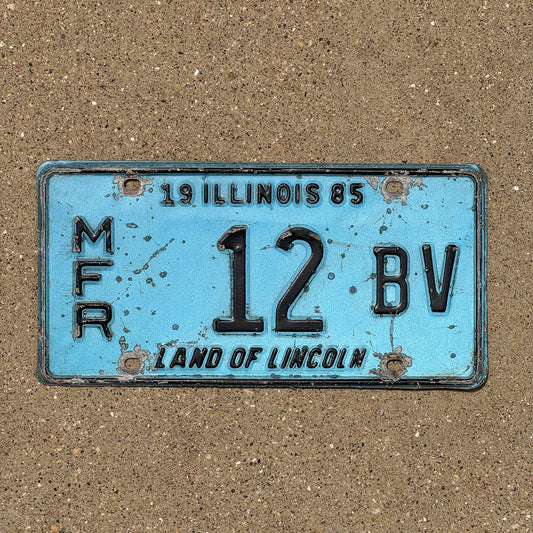Photo of a 1985 Illinois Manufacturer License Plate Auto Tag Garage Decor Vintage 12 BV