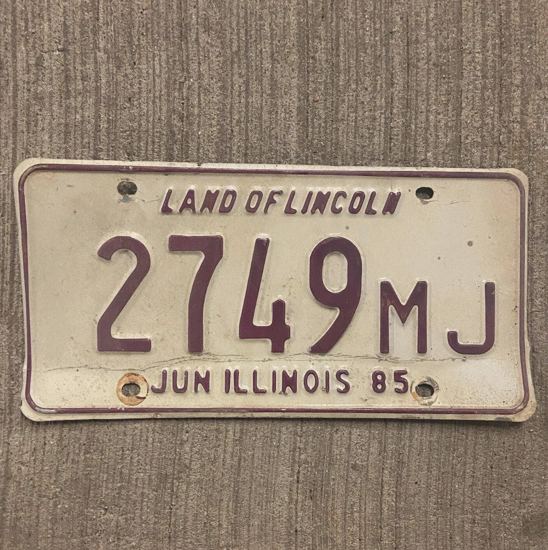 Photo of a 1985 Illinois Mileage Tax License Plate Auto Tag 2 Garage Decor 2749 MJ
