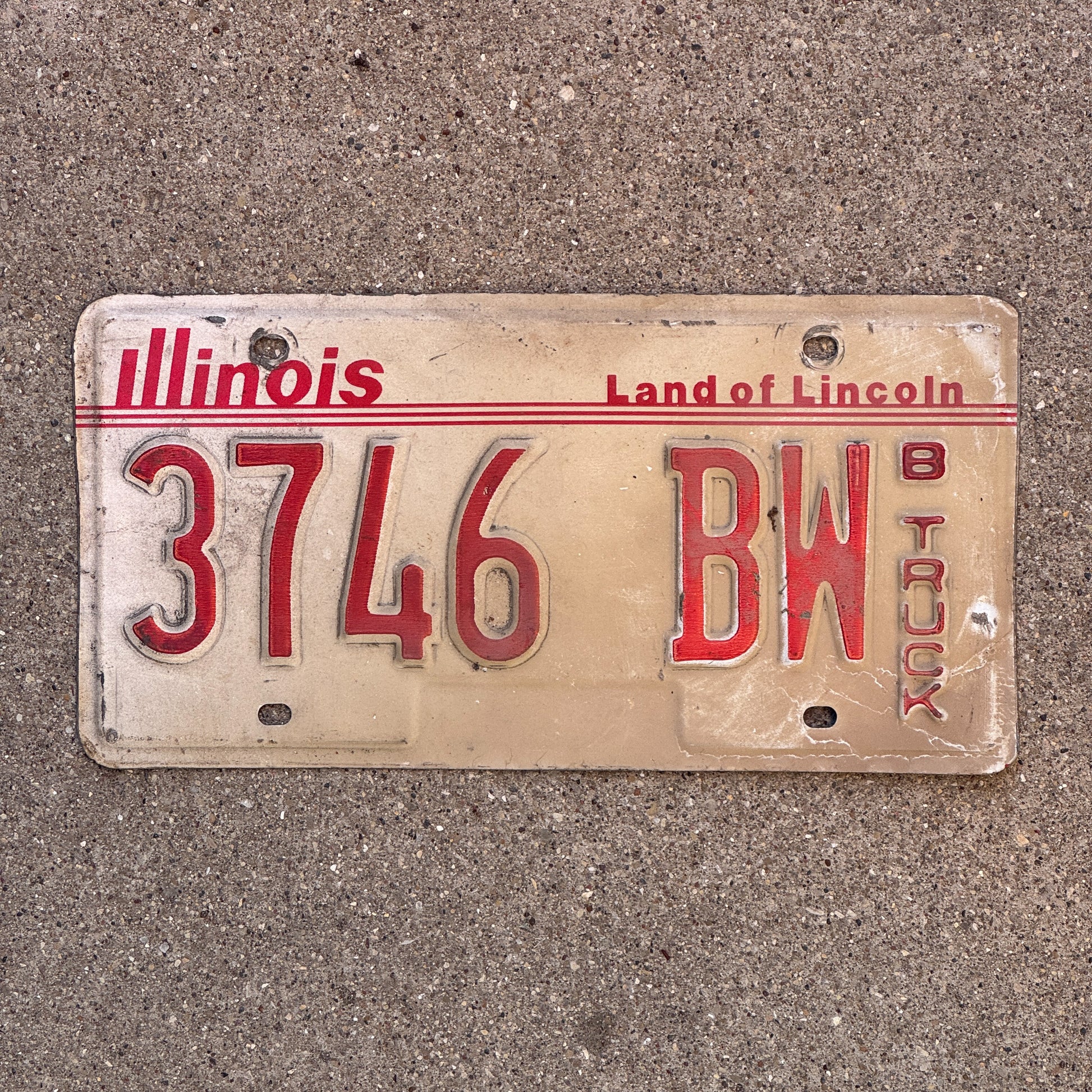Photo of a 1985 Illinois Truck License Plate Auto Tag Garage Decor Vintage 3746 BW with original patina