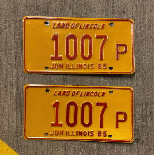Photo of a 1985 Illinois Truck License Plate Pair Auto Tag Garage Decor Vintage 1007 P with original patina
