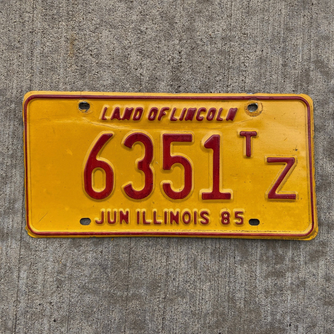 Photo of a 1985 Illinois Truck Tractor License Plate Auto Tag Garage Decor Vintage 6351 TZ with original patina