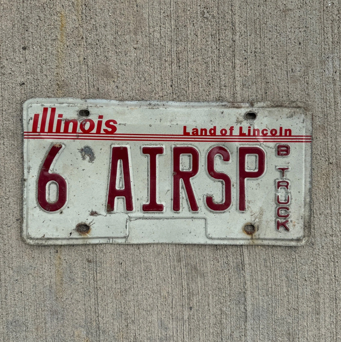 Photo of a 1985 Illinois Truck Vanity License Plate Auto Tag 2 Garage Decor Air Support Aerospace 6 AIRSP