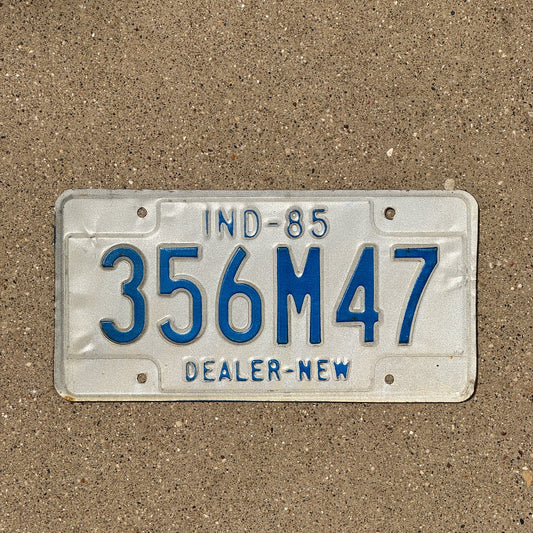 Photo of a 1985 Indiana Dealer License Plate Auto Tag Garage Decor Vintage 356 M 47