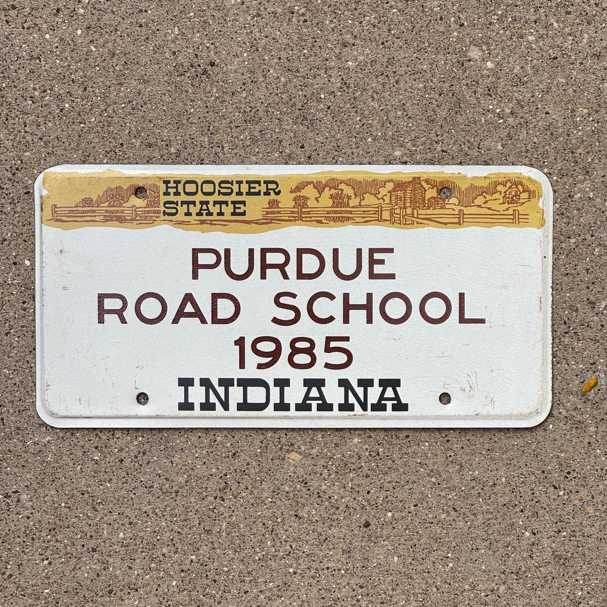 Photo of a 1985 Indiana License Plate Auto Tag Garage Decor Vintage Big Ten Purdue Road School with original patina