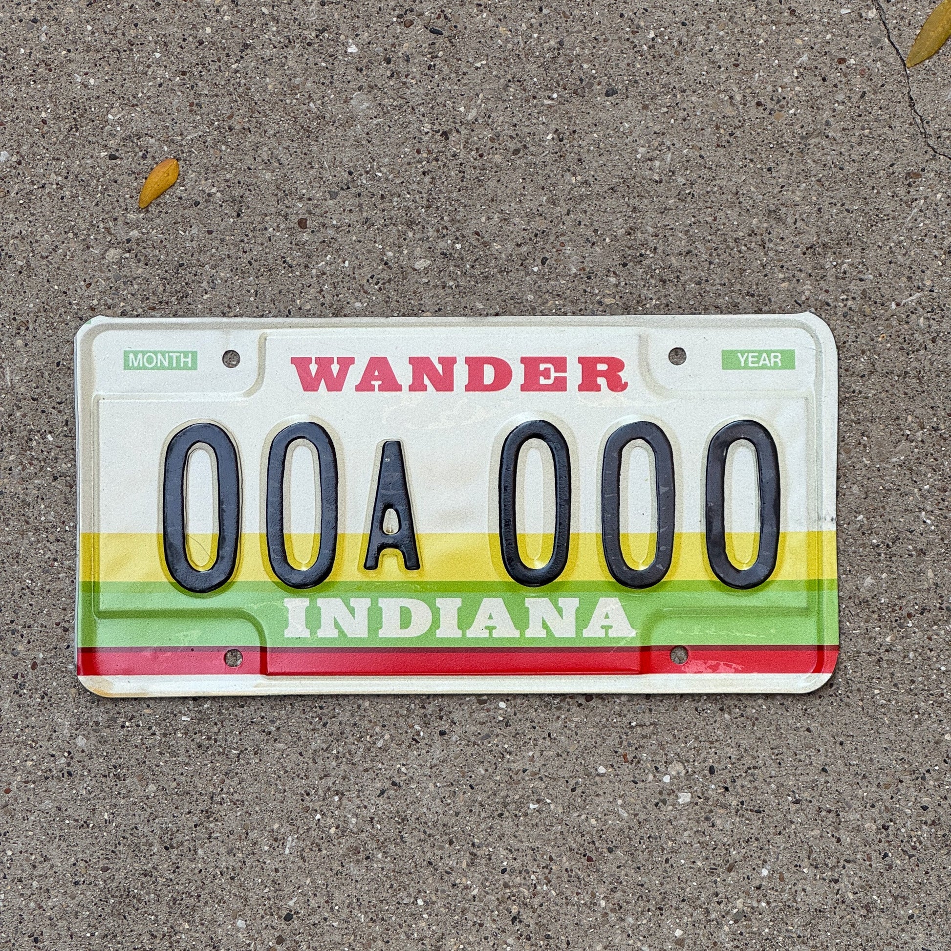Photo of a 1985 Indiana Sample License Plate Auto Tag Garage Decor Vintage 00A000 with original patina